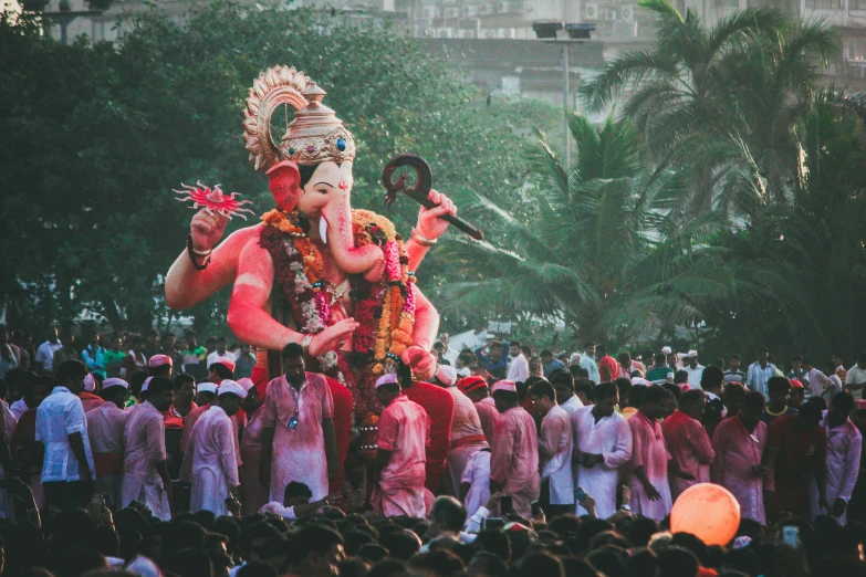 a large statue of an elephant in the middle of a crowd, pexels contest winner, samikshavad, wearing festive clothing, 🚿🗝📝, in sci - fi mumbai, ganesha