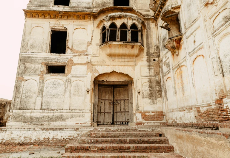 a very old building with a bunch of windows, pexels contest winner, baroque, india, many doorways, boarded up, thumbnail