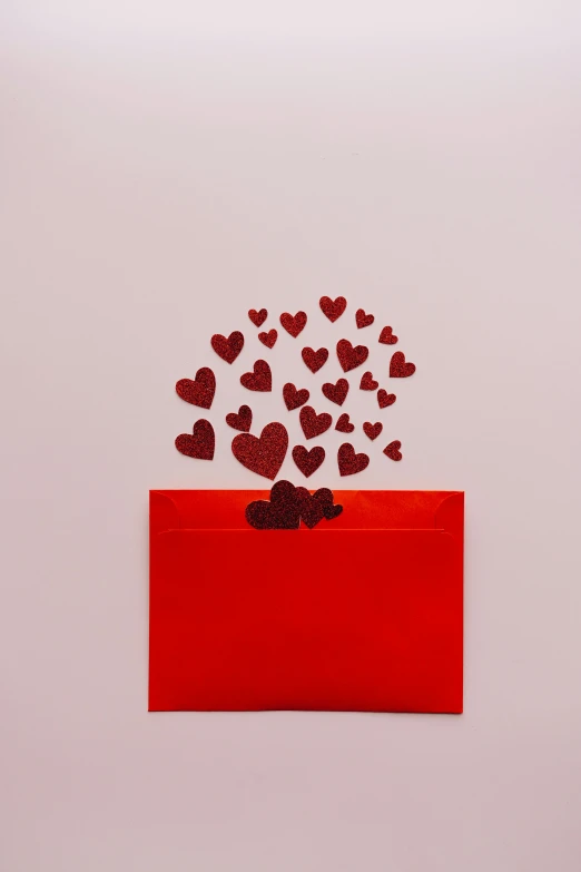 a red envelope with hearts coming out of it, product shot, detailed product image, 15081959 21121991 01012000 4k, frank franzettta