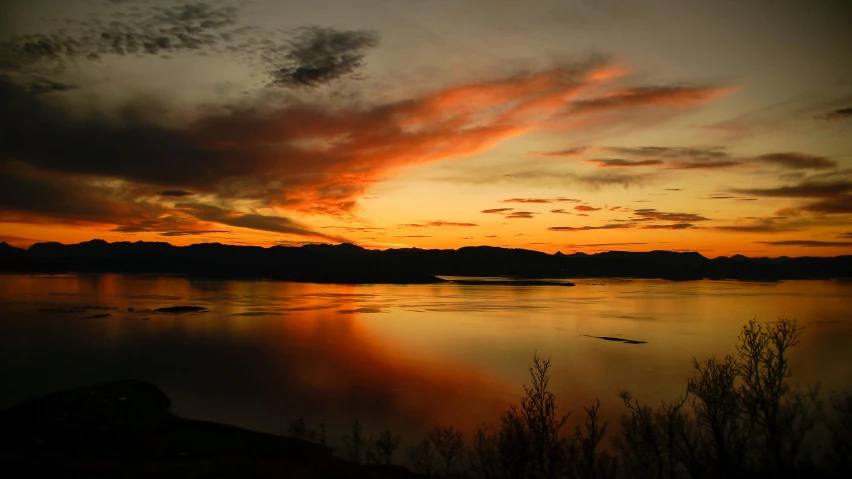 a large body of water with a sunset in the background, by Muggur, idaho, fan favorite, slide show, ((sunset))