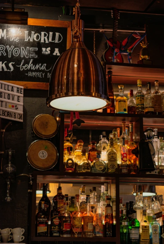 a bar filled with lots of bottles of alcohol, a portrait, unsplash, gas lamps, copper and brass, brown, trending photo