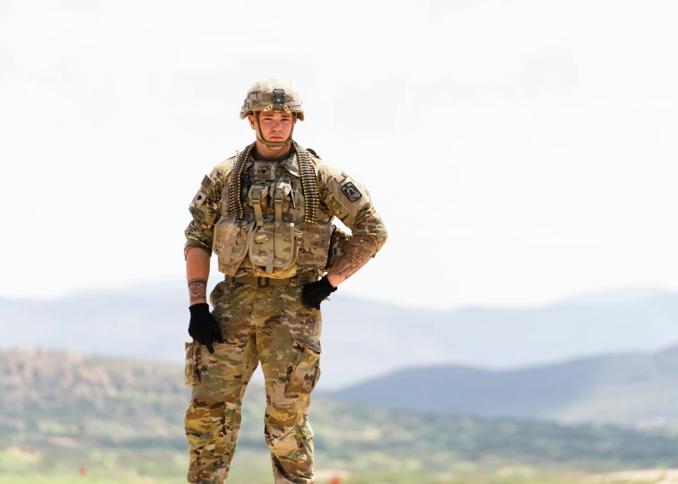 a man in camouflage standing on top of a hill, a portrait, pexels contest winner, renaissance, multicam uniform, new mexico, john krasinski, adaptive armor