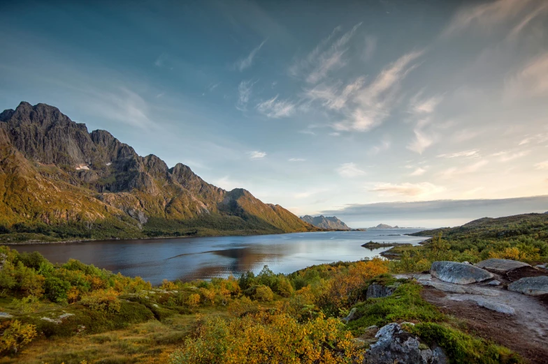 a large body of water surrounded by mountains, by Sebastian Spreng, pexels contest winner, hurufiyya, nordic crown, late summer evening, conde nast traveler photo, fan favorite