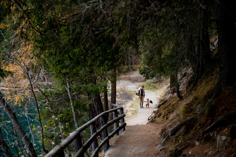 a couple of people that are walking down a path, by Jessie Algie, unsplash, banff national park, railing along the canal, thumbnail, arrendajo in avila pinewood