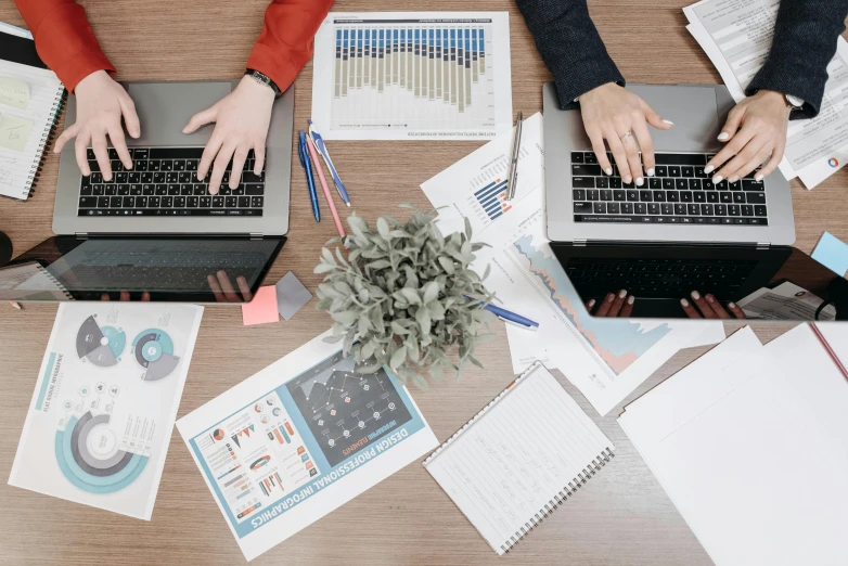 a group of people sitting at a table with laptops, by Carey Morris, trending on unsplash, analytical art, maths, papers on table, flatlay, 15081959 21121991 01012000 4k