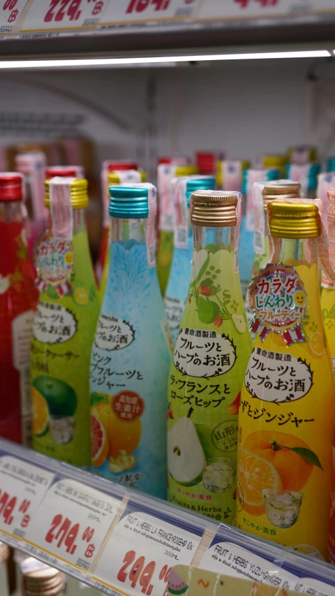 a display case filled with lots of different types of drinks, a picture, by Tsuruko Yamazaki, pexels, mingei, candy colors, square, bottle, summer