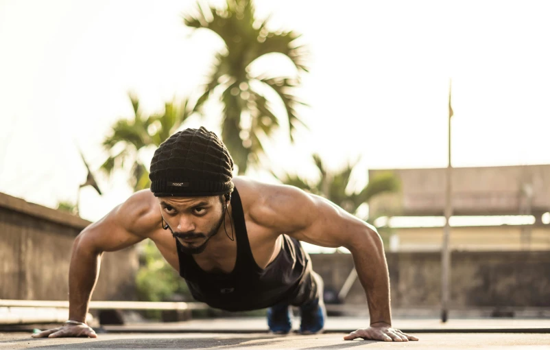 a man is doing push ups on a skateboard, a portrait, pexels contest winner, hurufiyya, vinayak, wearing fitness gear, avatar image, unedited