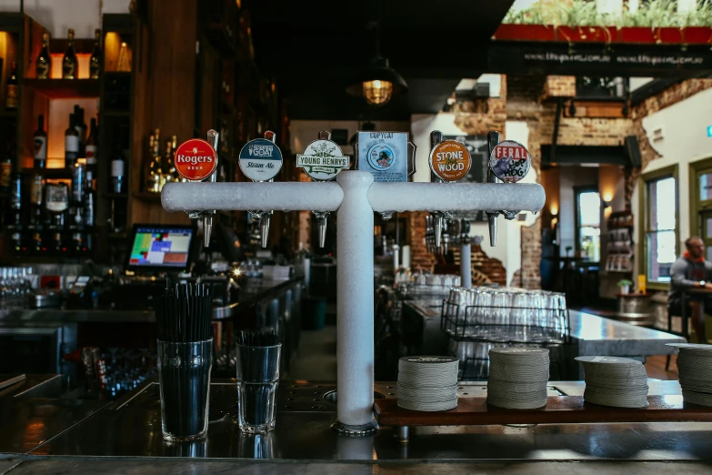 a bar filled with lots of different types of beer, by Carey Morris, pexels, taps with running water, lachlan bailey, closed limbo room, background image