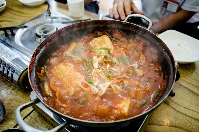 a pan of food sitting on top of a stove, hong soonsang, square, 4k photo”, fan favorite