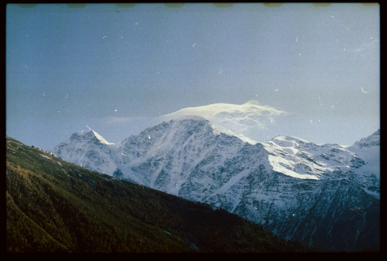 a view of a snow covered mountain range, a polaroid photo, les nabis, slide show, ansel ], view from a distance, british pathe archive