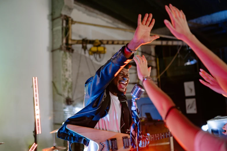 a man that is standing in front of a guitar, pexels contest winner, happening, “house music rave with dancers, victory lap, riyahd cassiem, industrial party