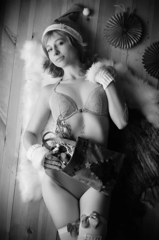 a black and white photo of a woman in lingerie, inspired by Diane Arbus, flickr, winter time, studio medium format photograph, glamourous cosplay, candy girl