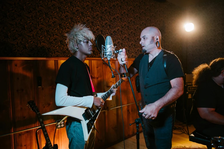 a couple of men that are standing in front of a microphone, an album cover, pexels, bald, practice, syd, epk