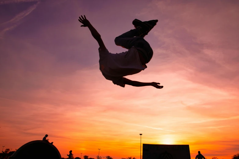 a man flying through the air while riding a skateboard, pexels contest winner, happening, sunset sky, avatar image, doing a backflip, full frame image