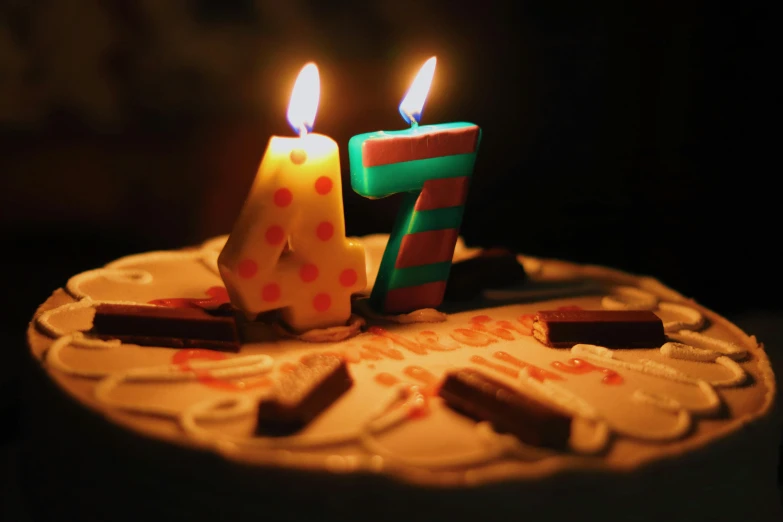 a birthday cake with candles on top of it, by Adam Szentpétery, pexels, photorealism, nineteen seventies, four years old, it follows :7, during the night