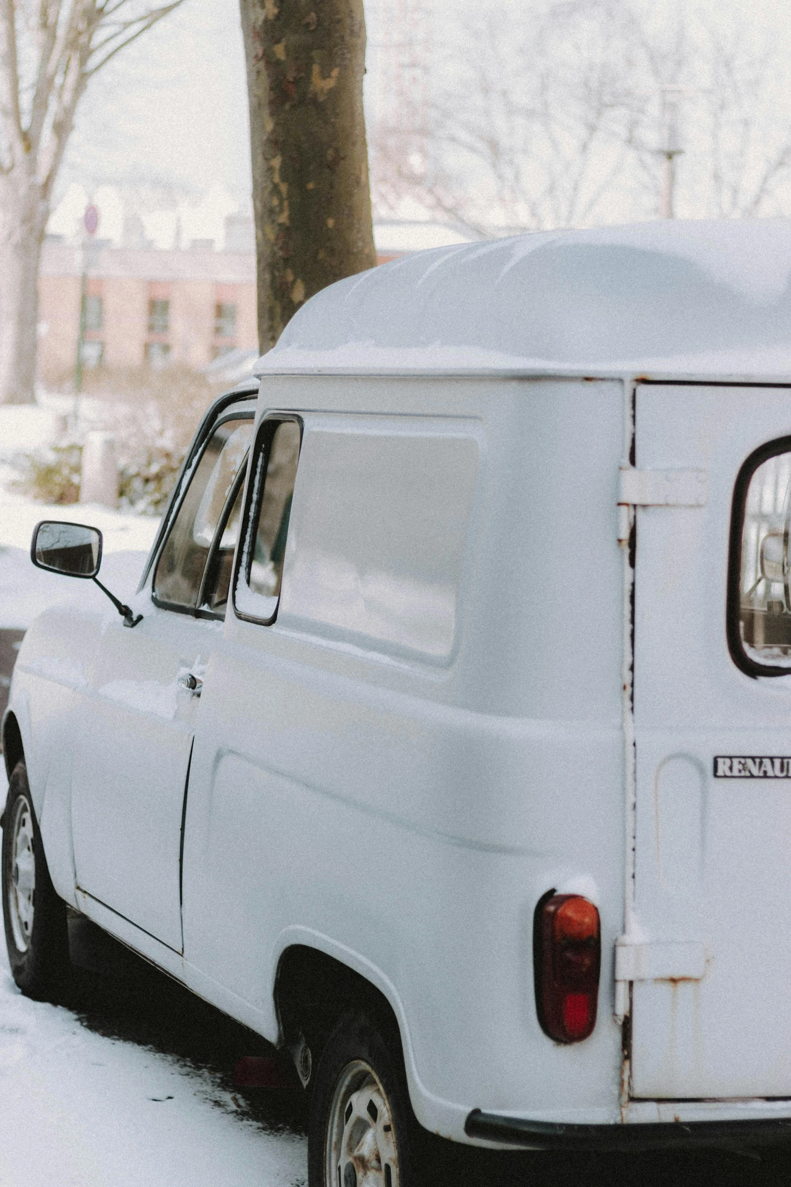 a white van is parked in the snow, by Sven Erixson, unsplash, renaissance, russian lada car, restoration, 000 — википедия, milkman