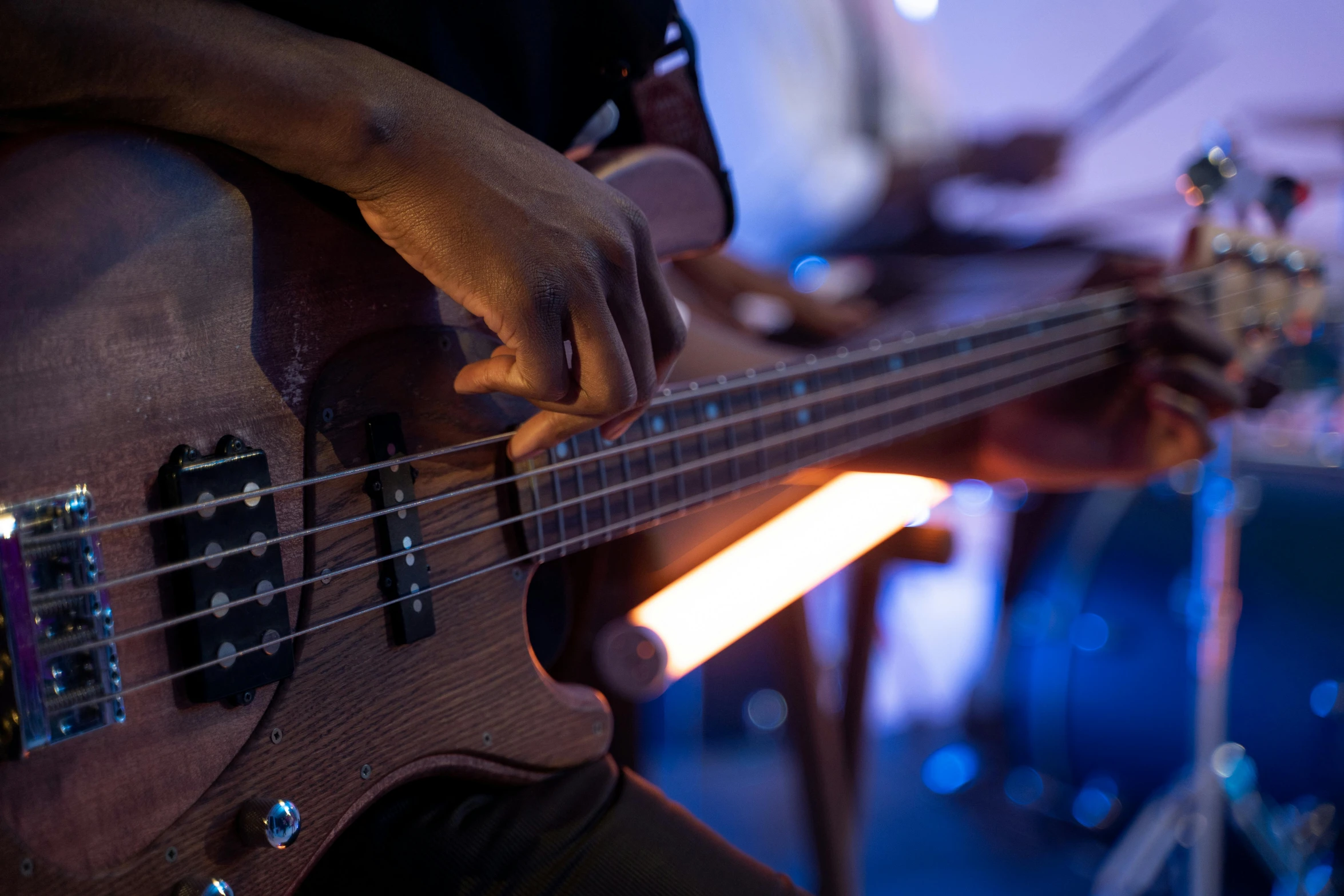 a close up of a person playing a bass guitar, unsplash, private press, lights on, profile image, thumbnail, rectangle