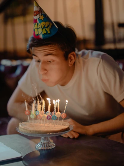 a boy blowing out candles on a birthday cake, trending on unsplash, happening, bisexual lighting, asian man, ( ( theatrical ) ), multiple stories