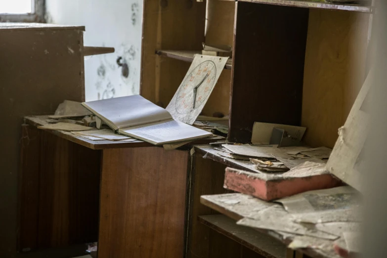 an open book sitting on top of a wooden desk, by Elsa Bleda, arte povera, abandoned hospital, where a large, thumbnail, pripyat