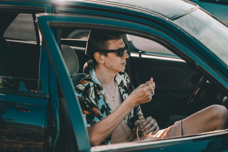 a man sitting in a car eating a donut, by Adam Marczyński, trending on pexels, renaissance, with hawaiian shirt, cigarette, thin young male, profile image