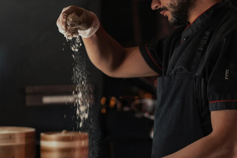 a man in a black shirt is sprinkled with flour, pexels contest winner, plating, malt, lachlan bailey, thumbnail