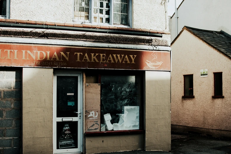 a store front with a sign that says indian takeaway, by Gavin Nolan, trending on unsplash, art nouveau, in dunwall, view from far away, light tan, ian david soar
