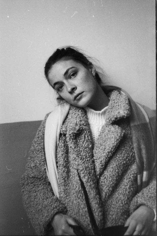 a black and white photo of a woman in a coat, ✨🕌🌙, teenage girl, alison hannigan, davide sorrenti