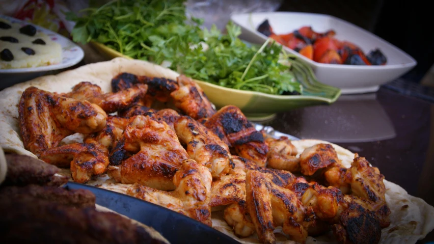 a close up of a plate of food on a table, grilled chicken, offering a plate of food, chickens, profile image