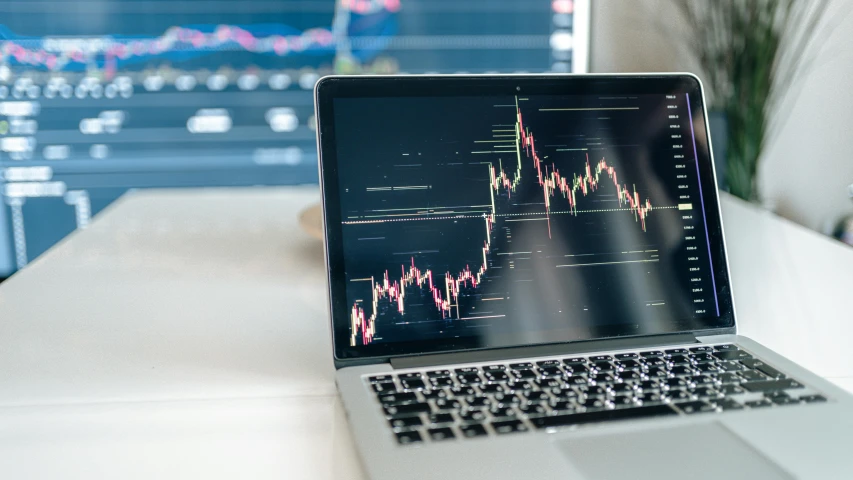 a laptop computer sitting on top of a desk, by Daniel Lieske, trending on unsplash, analytical art, displaying stock charts, maths, cryptocurrency, giving a speech