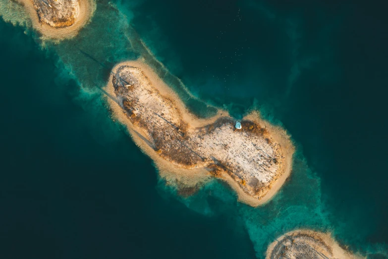 an aerial view of an island in the middle of the ocean, by Adam Marczyński, pexels contest winner, hurufiyya, croatian coastline, close-up imagery, multiple stories, portait photo