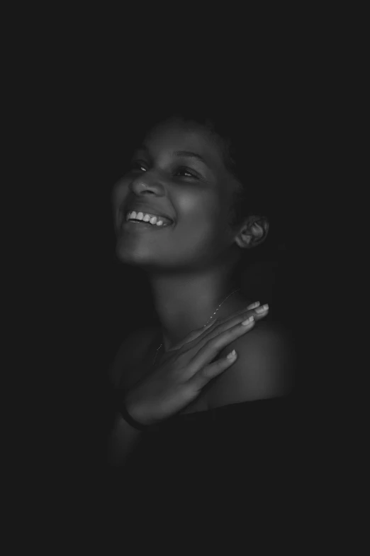 a black and white photo of a woman smiling, by Nadir Afonso, unsplash, conceptual art, alternate album cover, black teenage girl, lit from the side, various posed