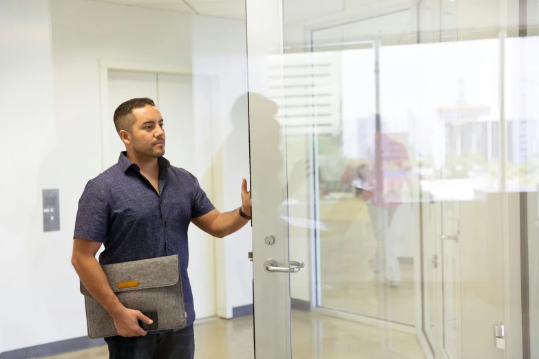 a man standing in front of a glass door, backrooms office space, fan favorite, customers, maintenance