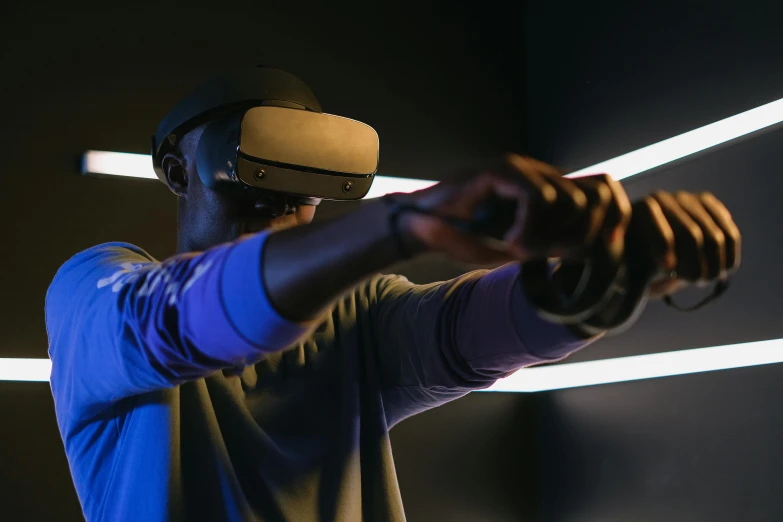 a man in a blue shirt holding a baseball bat, a digital rendering, unsplash, interactive art, using a vr headset, afro tech, thumbnail, gaming room in 2 0 4 0