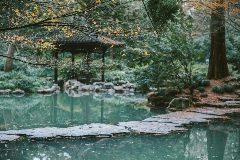 a gazebo in the middle of a pond surrounded by trees, inspired by Tōshi Yoshida, unsplash, australian tonalism, pools of water, autum garden, teal aesthetic, rock pools