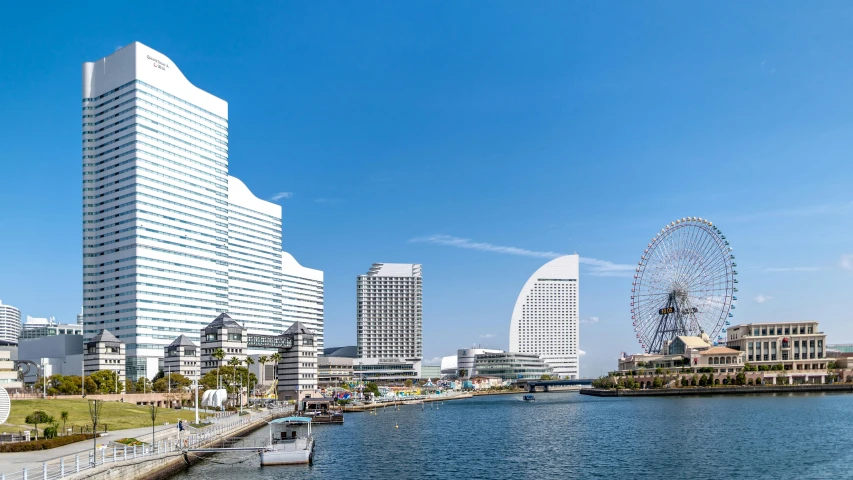 a large body of water surrounded by tall buildings, by Yasushi Sugiyama, pexels contest winner, neogeo, seaside, clear sunny day, ad image, enhanced photo