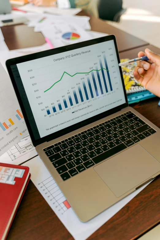 a laptop computer sitting on top of a wooden table, analytical art, graphs, thumbnail, large, brown