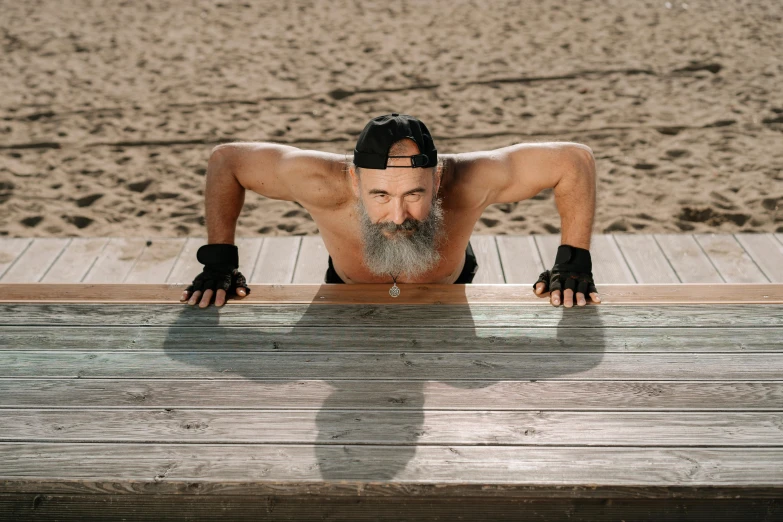 a man doing push ups on a wooden bench, by Kazimierz Wojniakowski, pexels contest winner, hyperrealism, white beard, on the sand, avatar image, 6 pack