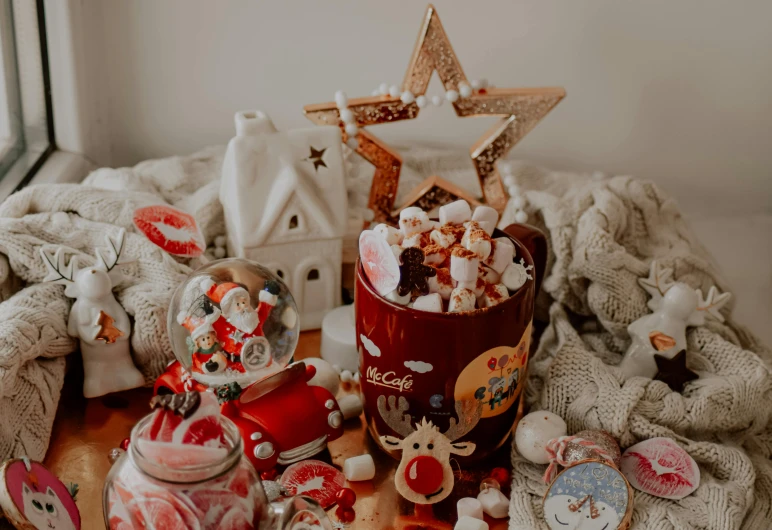 a cup filled with hot chocolate and marshmallows, a picture, by Julia Pishtar, pexels contest winner, candy decorations, many stars, indoor scene, covered in