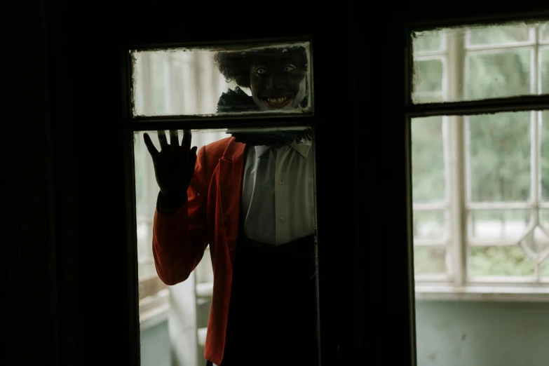 a person that is standing in front of a window, inspired by Pietro Longhi, pexels contest winner, black man with afro hair, inside haunted house, welcome to wonderland, mime