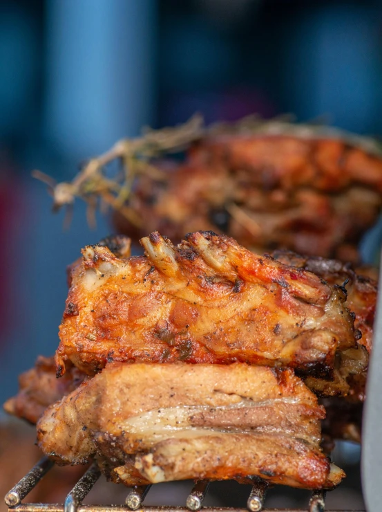 a bunch of meat sitting on top of a grill, serving rack of ribs, close up food photography, profile pic, f/8.0