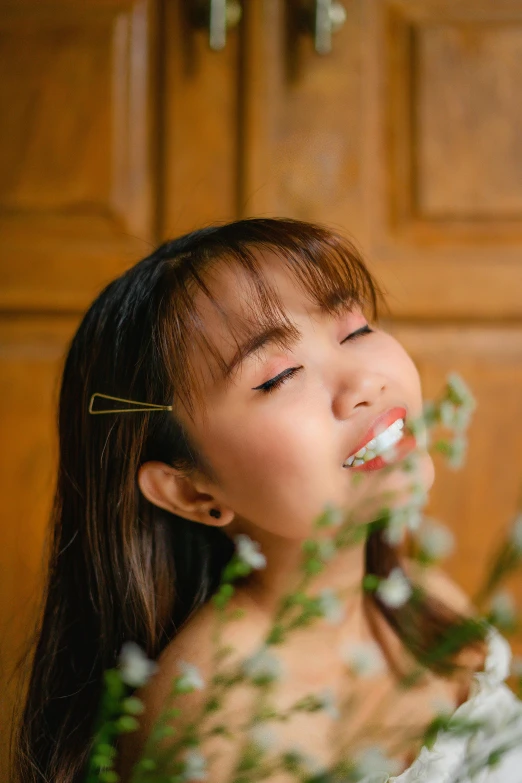 a woman brushing her teeth with a toothbrush, inspired by Ruth Jên, aestheticism, brown bangs, flower in her hair, 2019 trending photo, asian female