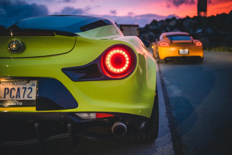 a yellow sports car parked on the side of the road, by Jason Felix, pexels contest winner, synchromism, rear lighting, 2015 alfa romeo 4c, various colors, close-up shot taken from behind
