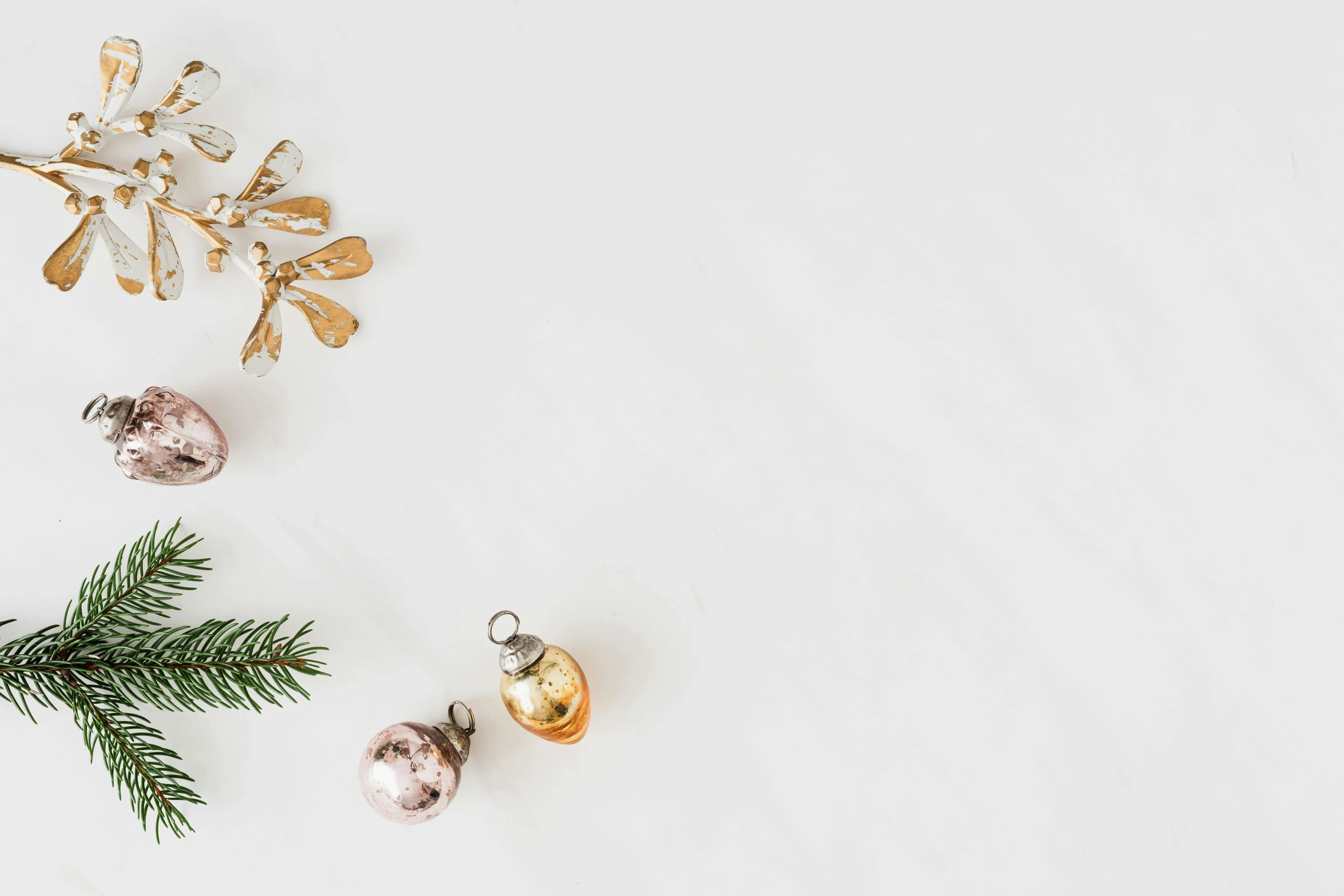 christmas decorations laid out on a white surface, trending on pexels, minimalism, background image, gold flaked flowers, thumbnail, high quality image