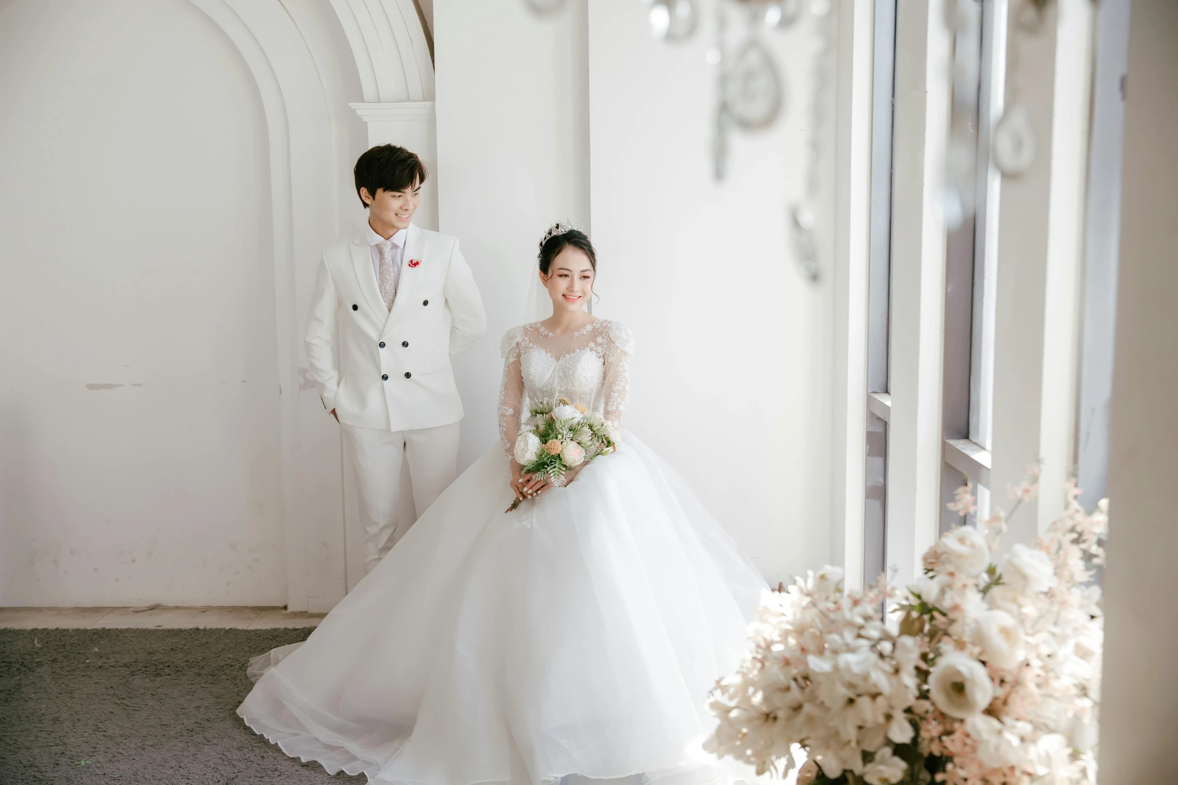 a bride and groom standing next to each other, inspired by Kim Jeong-hui, pexels contest winner, white room, cai xukun, background image, holiday