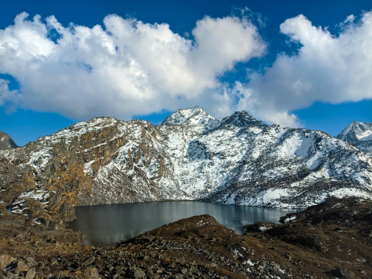 a large body of water surrounded by snow covered mountains, hurufiyya, thumbnail, naga-hakash, lpoty, lakes
