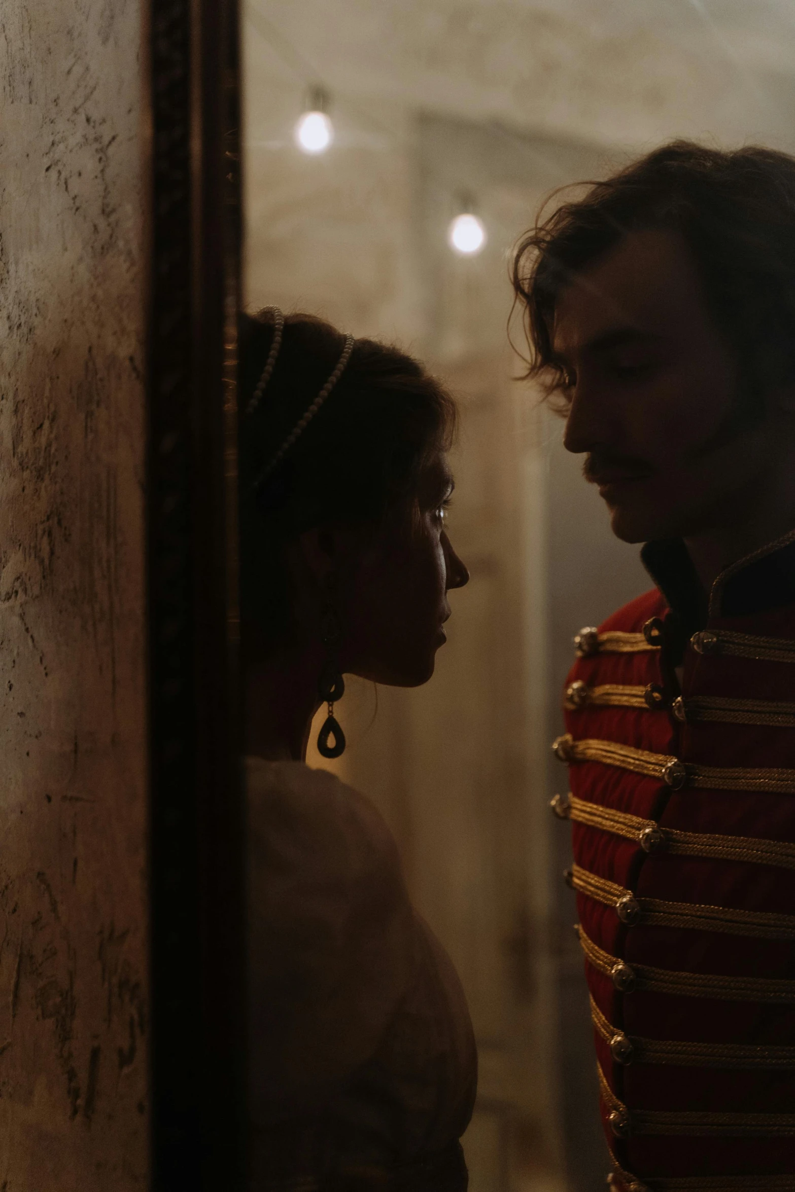a man and a woman standing next to each other, a picture, inspired by Karl Bryullov, pexels contest winner, still from a terence malik film, napoleonic wars, looking around a corner, [ theatrical ]