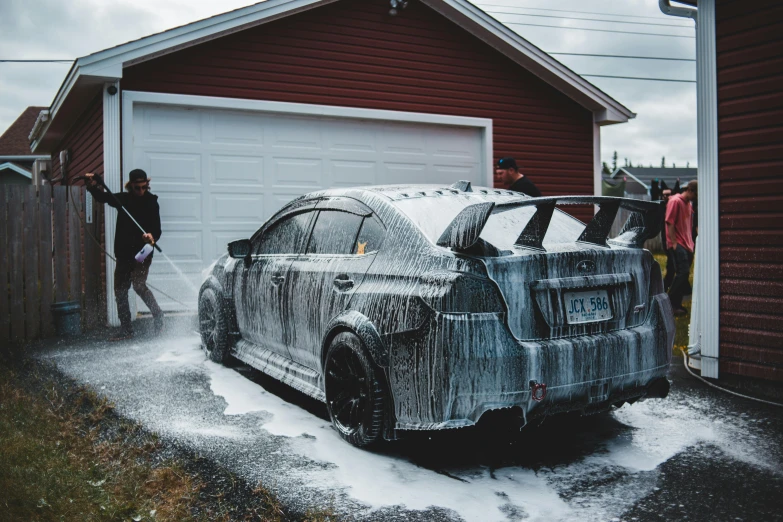 a man washing a car with a hose, by Julia Pishtar, pexels contest winner, auto-destructive art, wrx golf, quebec, samurai vinyl wrap, cold as ice! 🧊