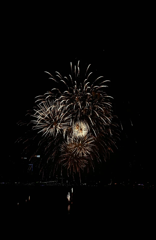a fireworks is lit up in the night sky, hurufiyya, 15081959 21121991 01012000 4k, low quality photo, thumbnail, n9