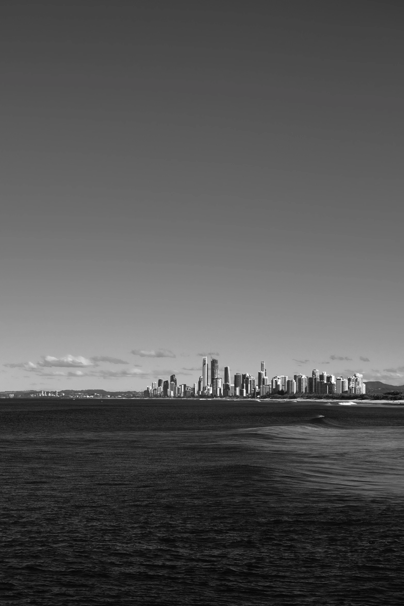 a black and white photo of a city skyline, a black and white photo, inspired by Max Dupain, minimalism, coastline, 15081959 21121991 01012000 4k, :: morning, city panorama