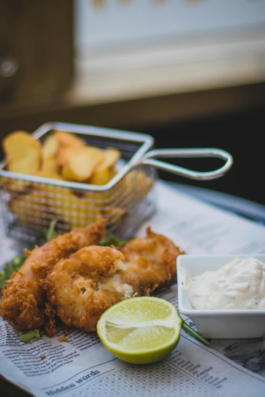 a close up of a plate of food on a table, by Tom Bonson, unsplash, deep fried, fins, square, cream